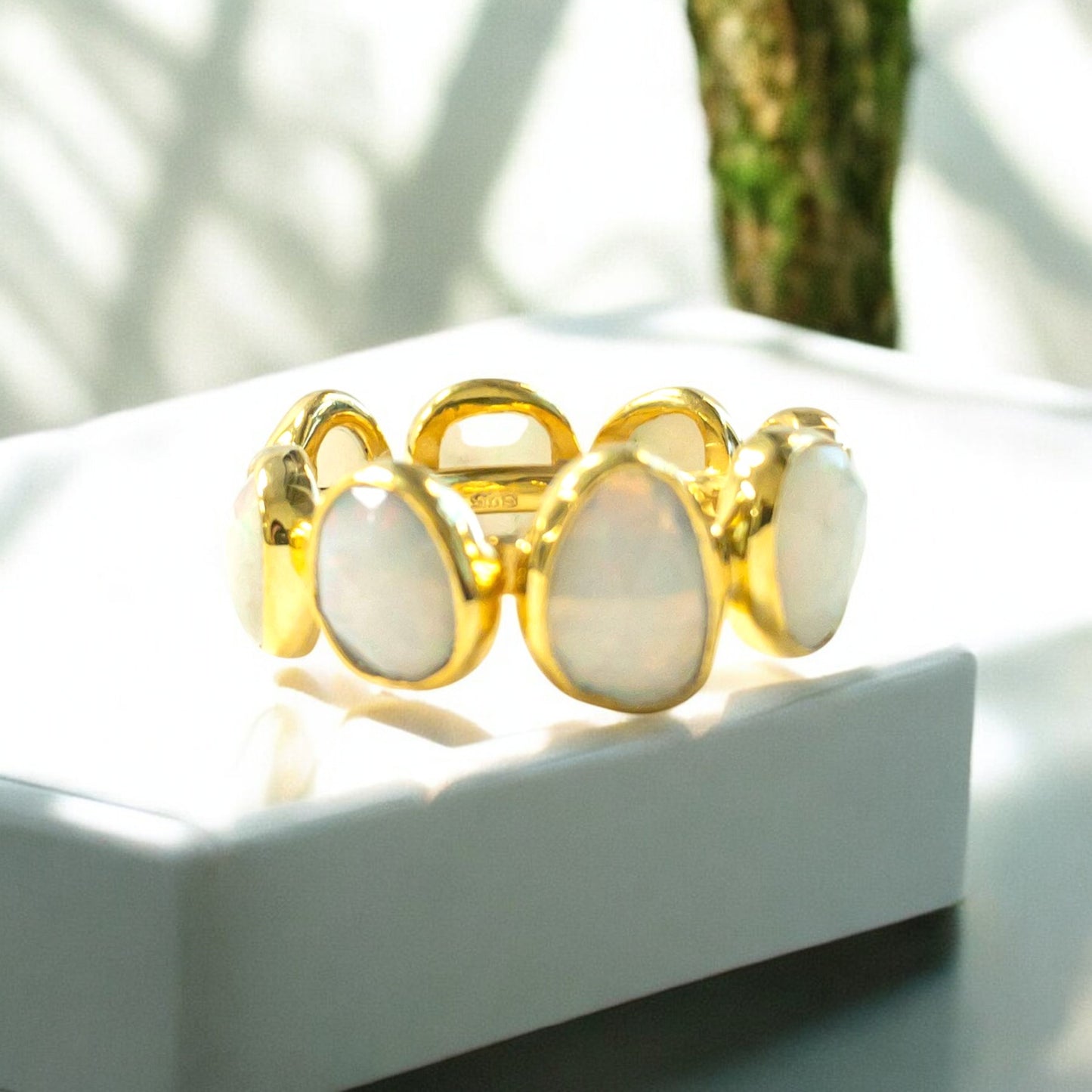 18K yellow gold eternity band ring with oval opals.