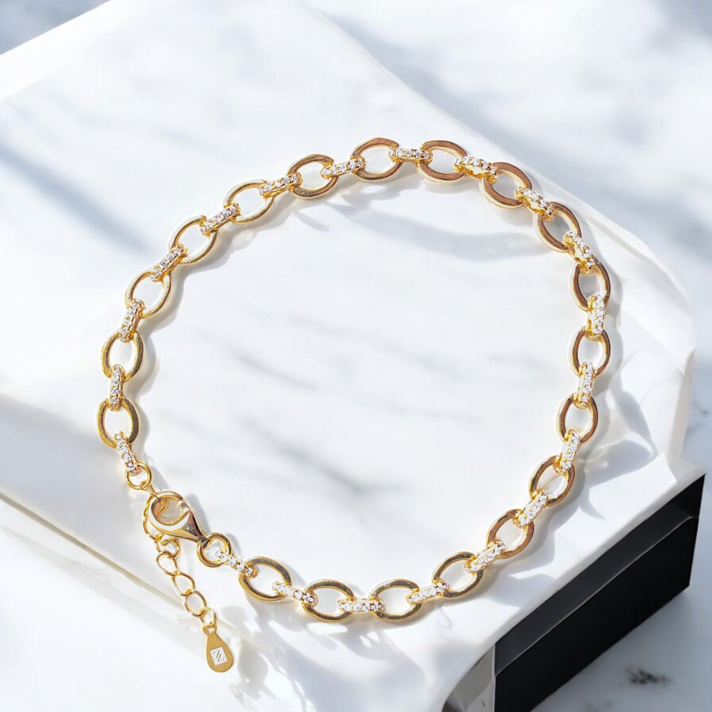 18K gold-plated oval link bracelet with cubic zirconia stones and lobster clasp