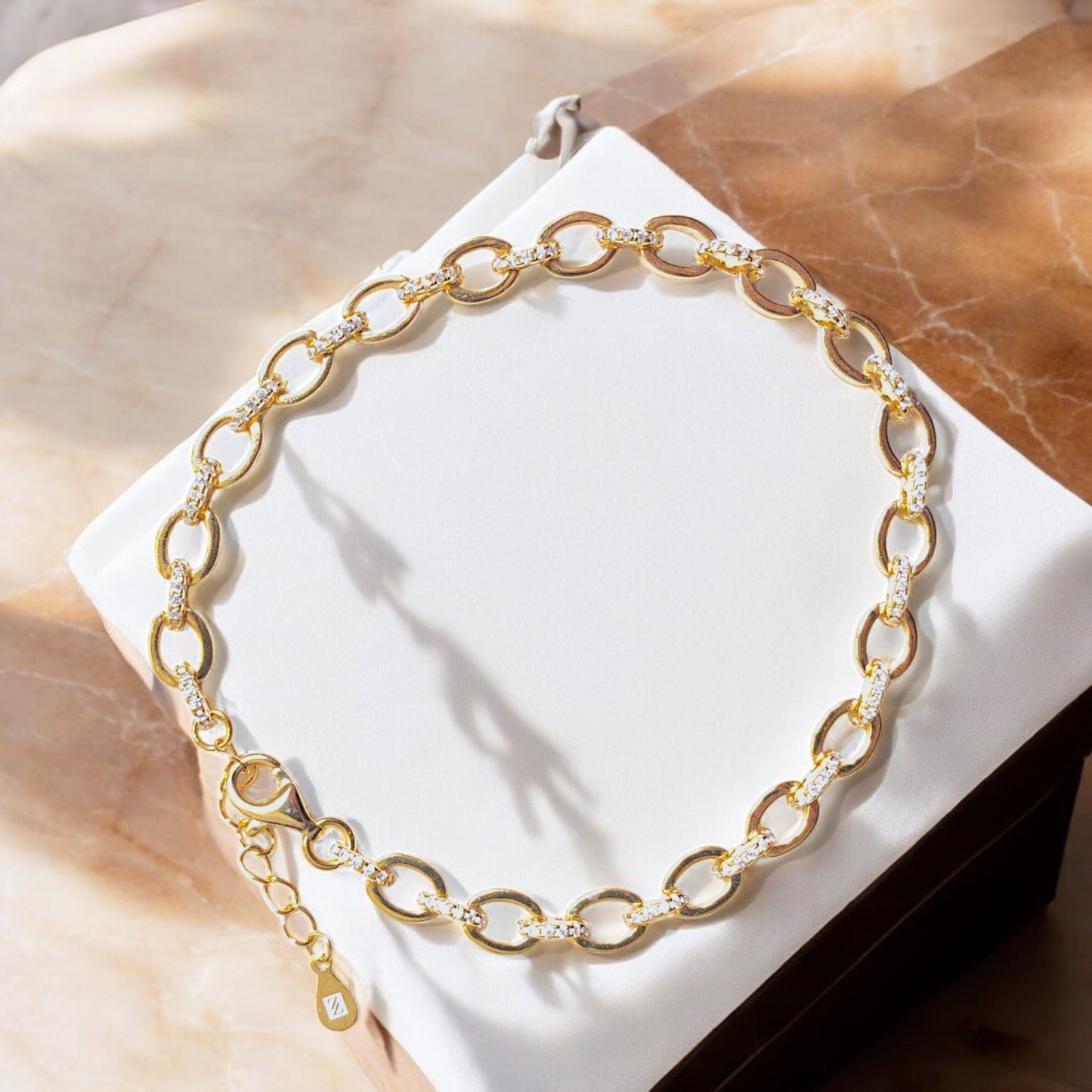 18K gold-plated oval link bracelet with cubic zirconia stones and lobster clasp
