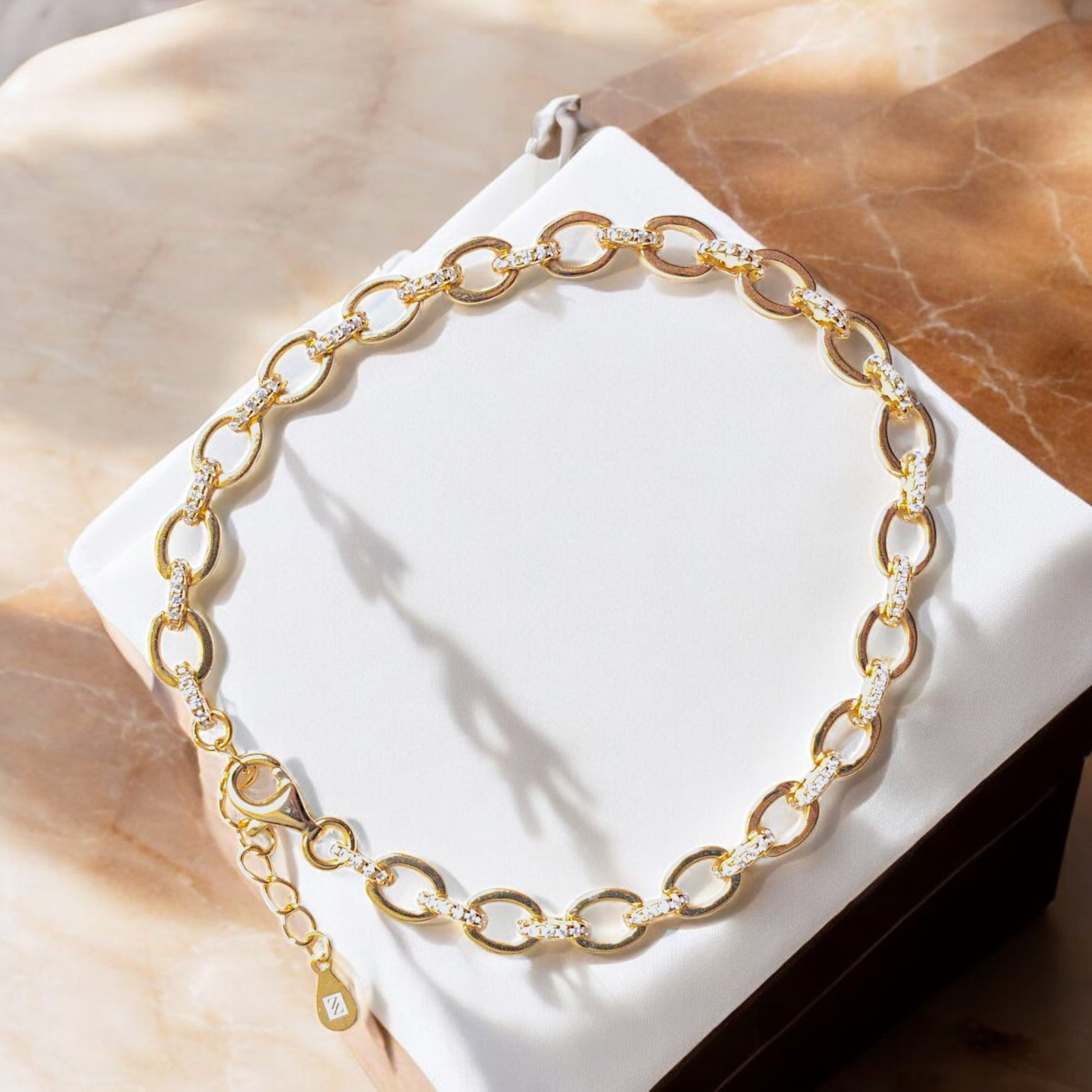18K gold-plated oval link bracelet with cubic zirconia stones and lobster clasp